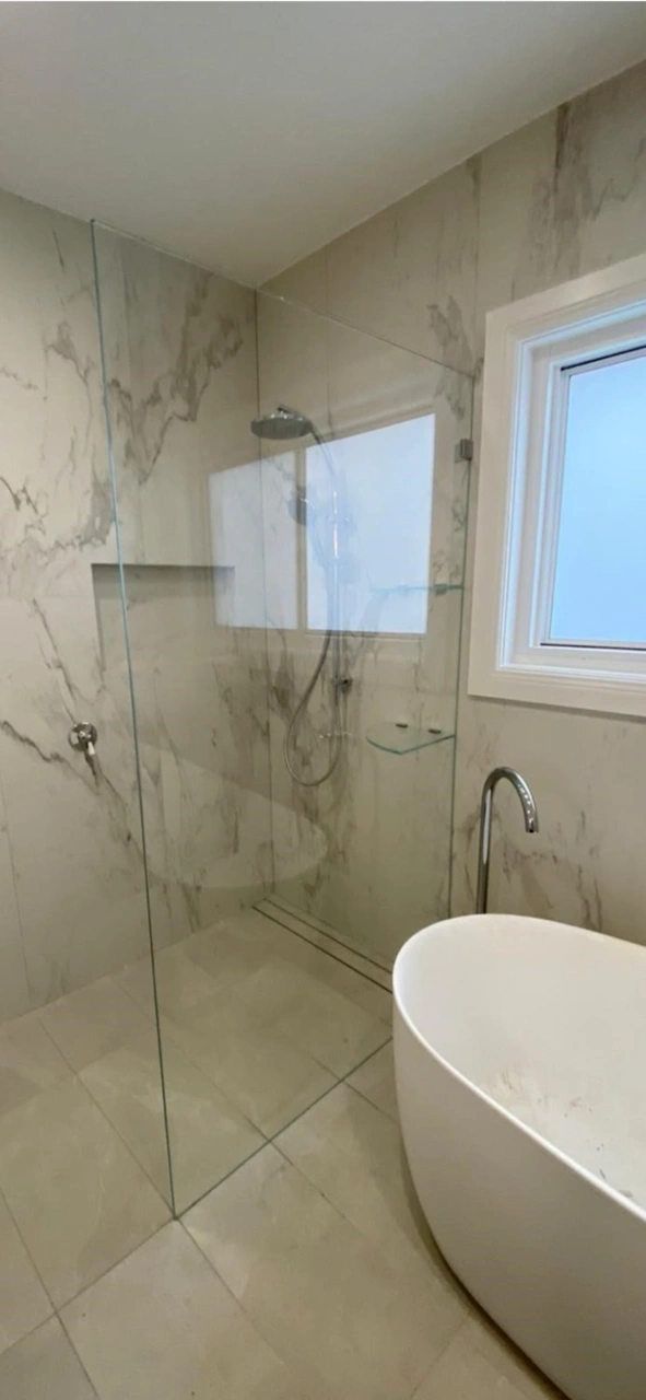 Completed bathroom renovation with freestanding tub